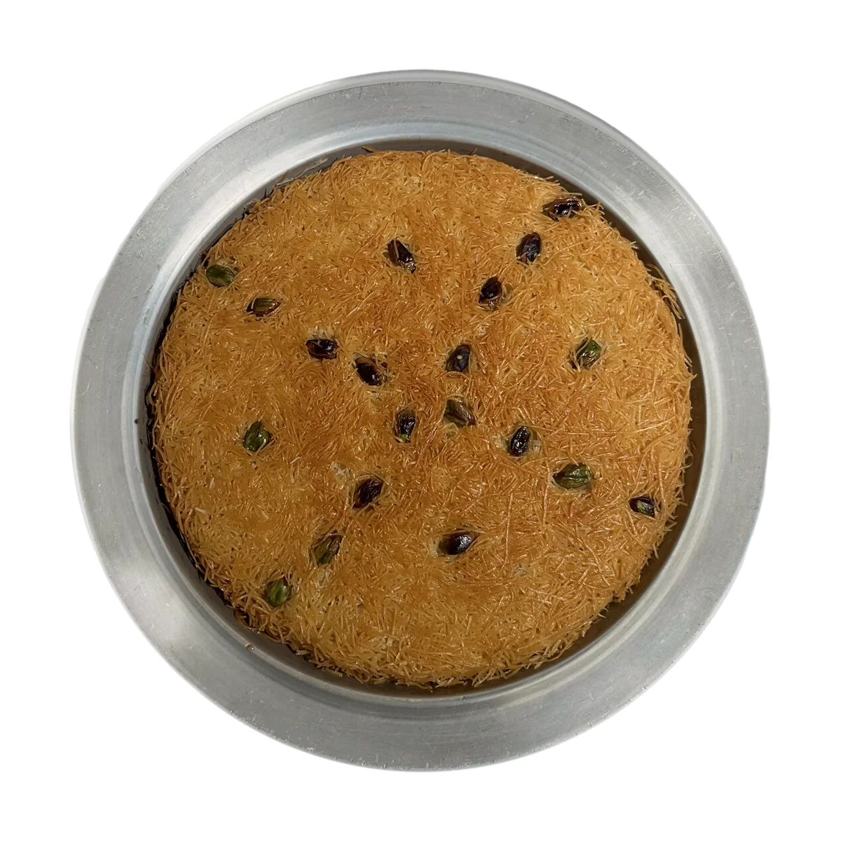 Classic künefe seen from above: golden kadayıf on a silver plate, scattered with pistachios